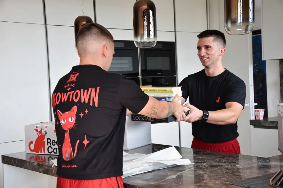 Red Cat local movers packing a kitchen