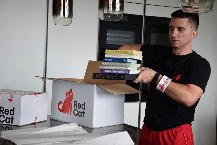 Red Cat movers packing moving boxes