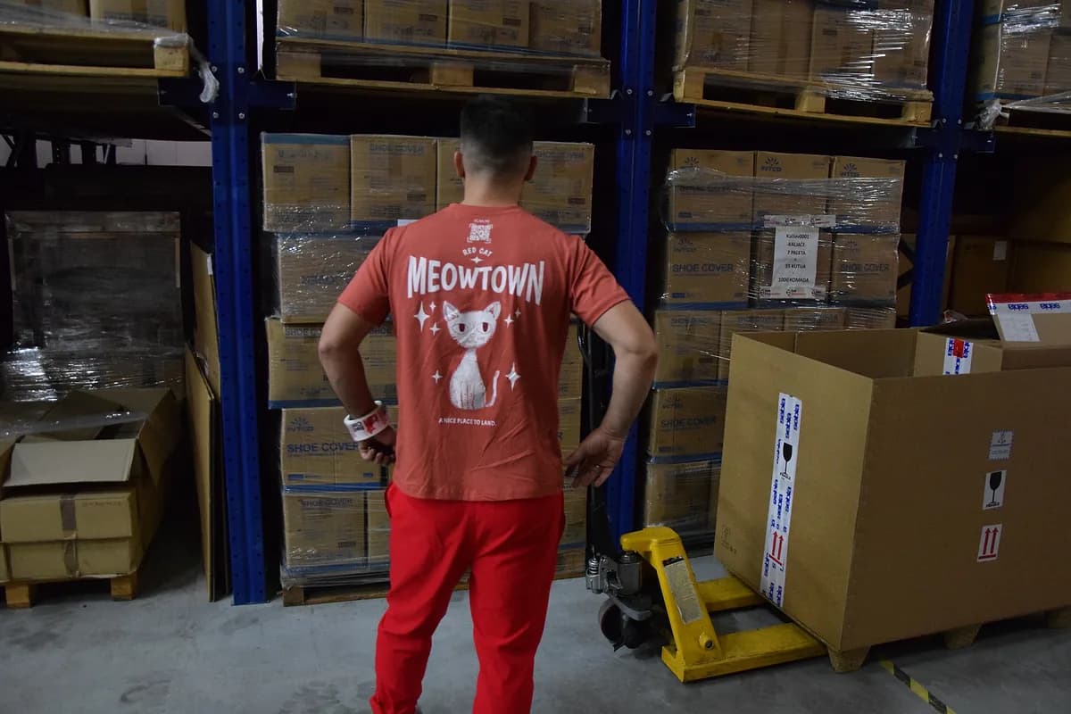 Red Cat warehouse mover checking pallet racks before a move
