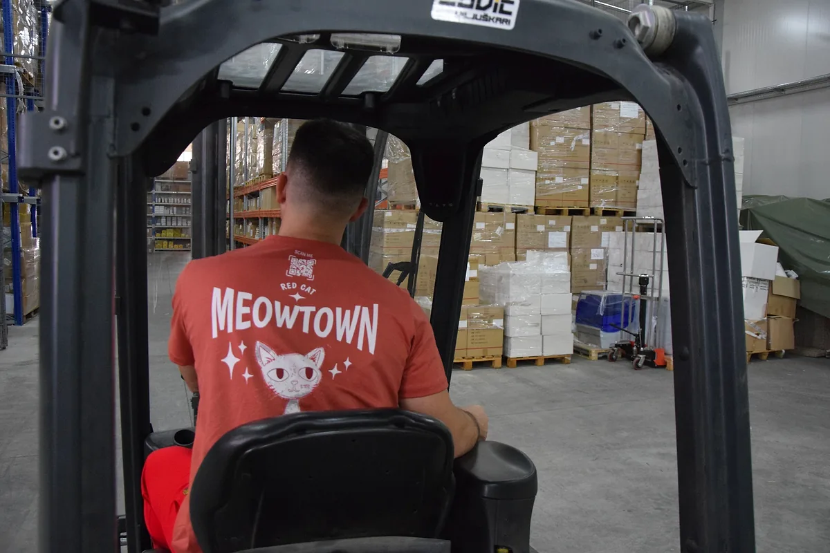 Red Cat warehouse mover driving a forklift